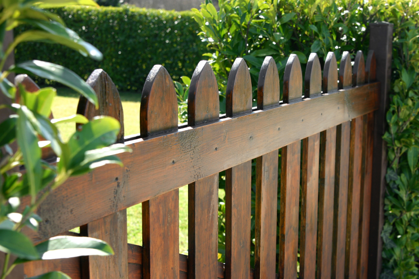 Wood garden fencing installed for backyard privacy